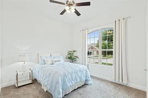a bed room with a bed and a window