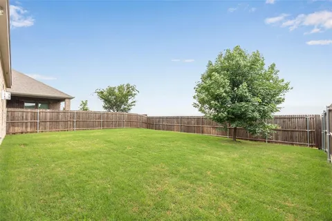 a view of a backyard with a garden