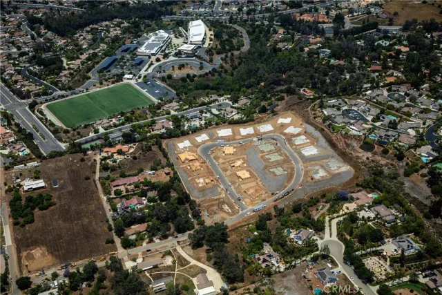 an aerial view of residential house and green space