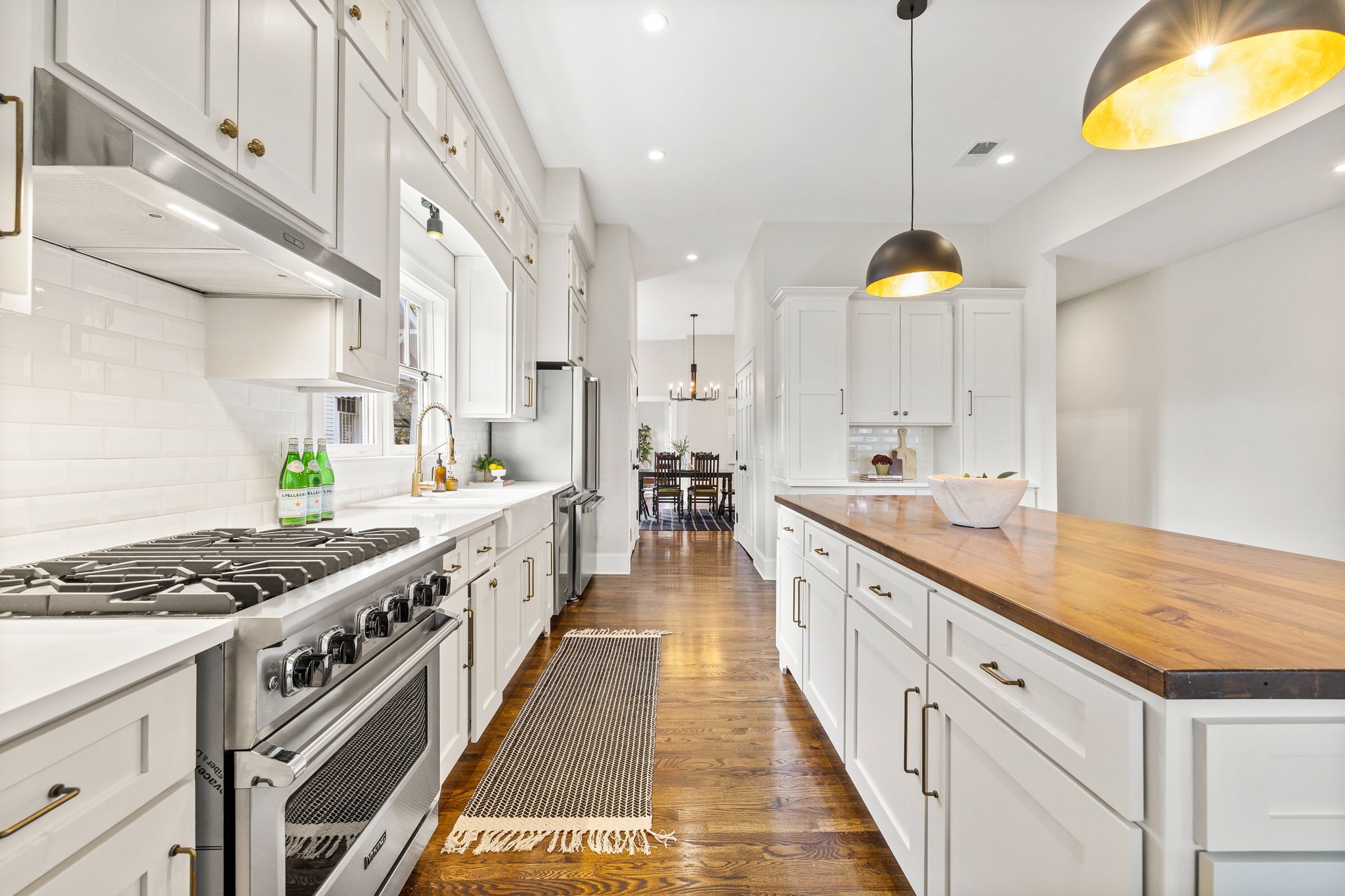 1412 Ordway Place Nashville, TN 37206 - Photo 37 of 70 a large white kitchen with stainless steel appliances granite countertop a stove and a sink