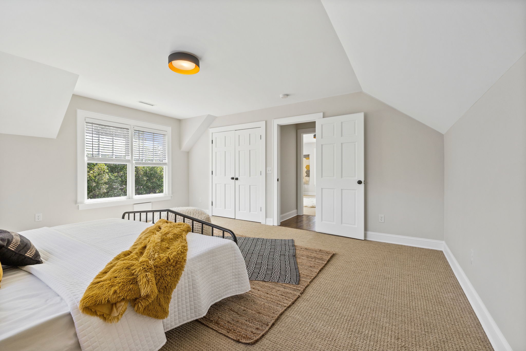 1412 Ordway Place Nashville, TN 37206 - Photo 55 of 70 a bed sitting in a bedroom next to a window