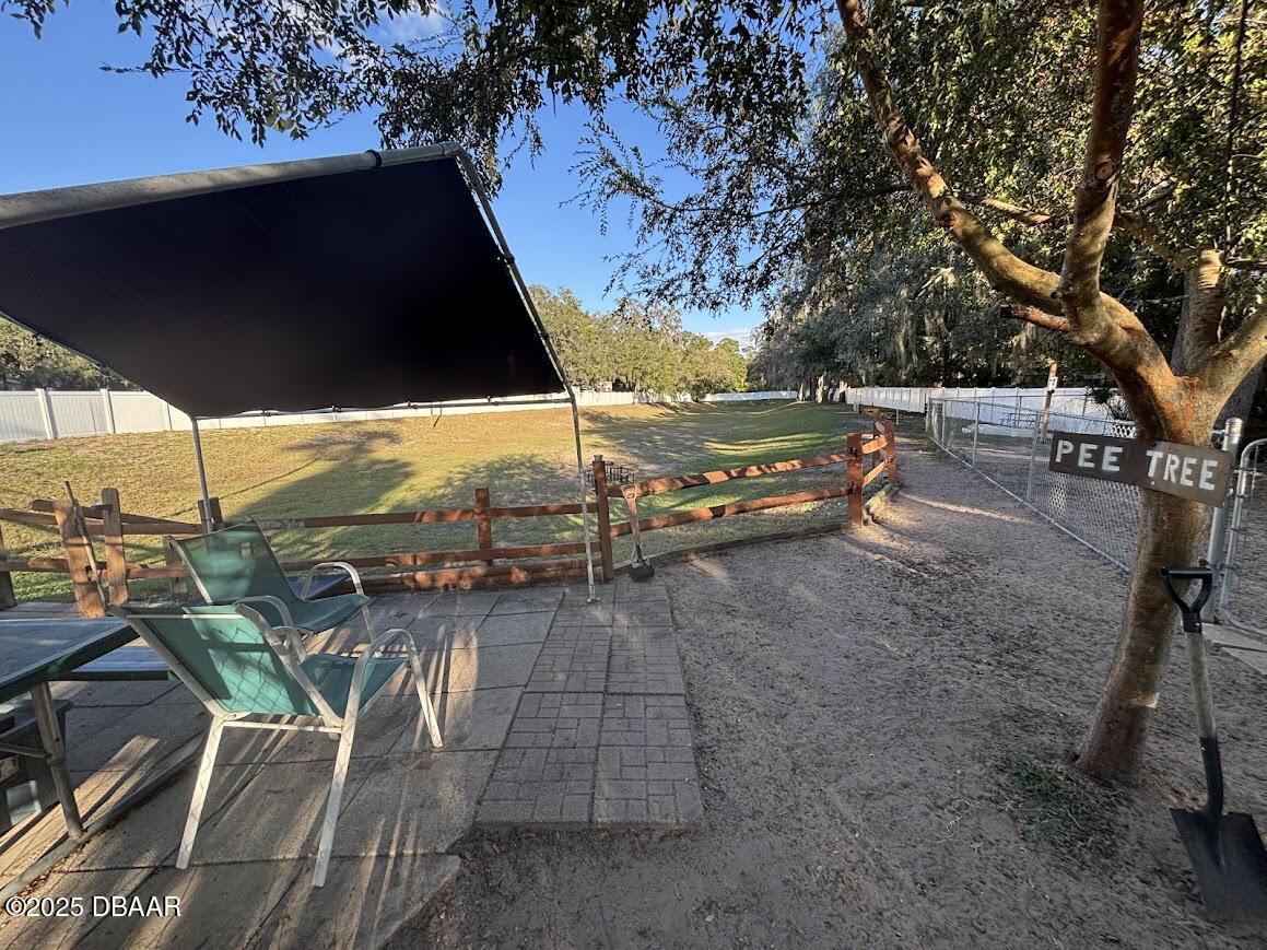 25145 Northeast 140th Loop Salt Springs, FL 32134 - Photo 23 of 48 a view of a outdoor space with seating area