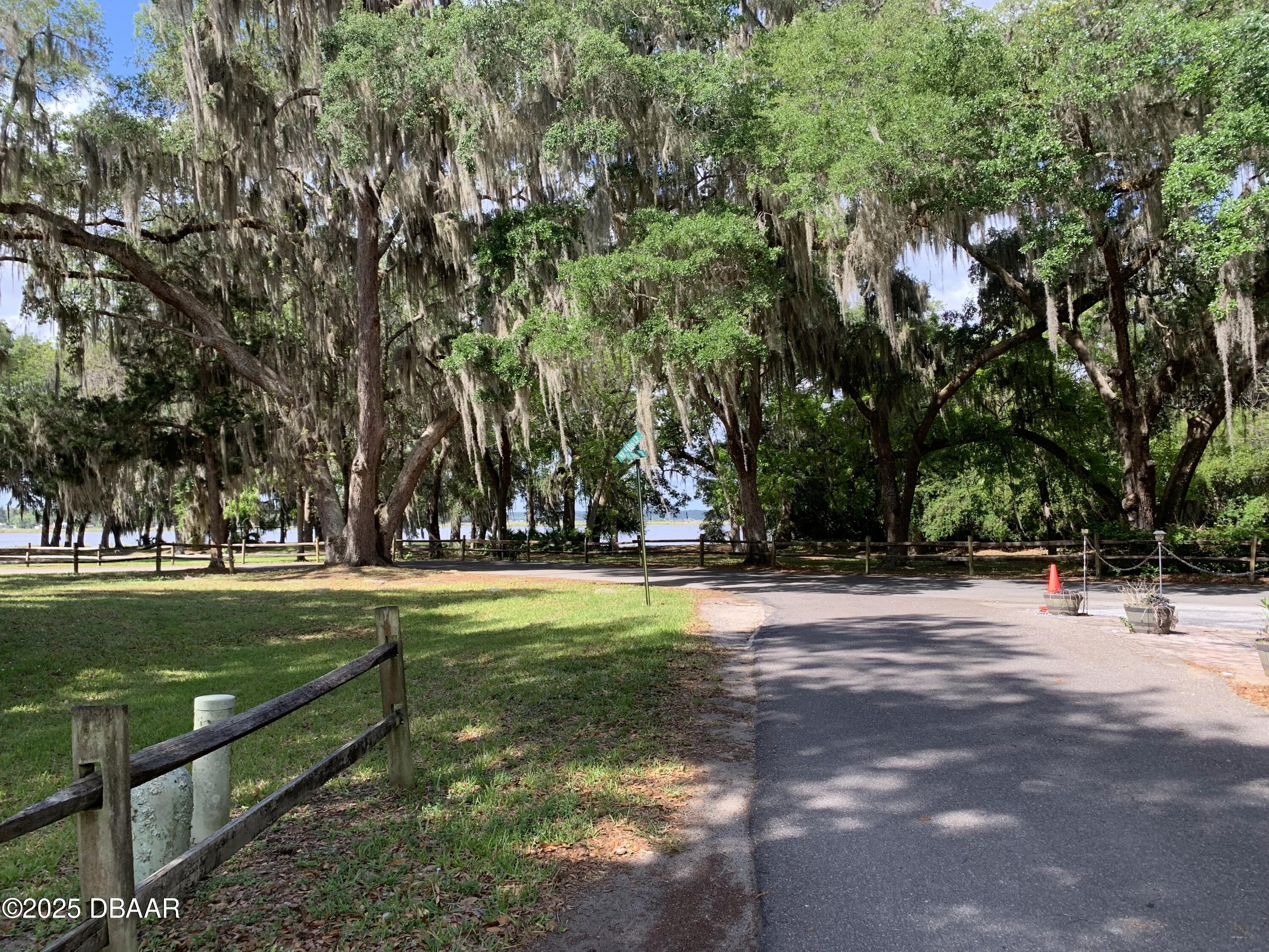 25145 Northeast 140th Loop Salt Springs, FL 32134 - Photo 3 of 48 a view of a golf course with a trees
