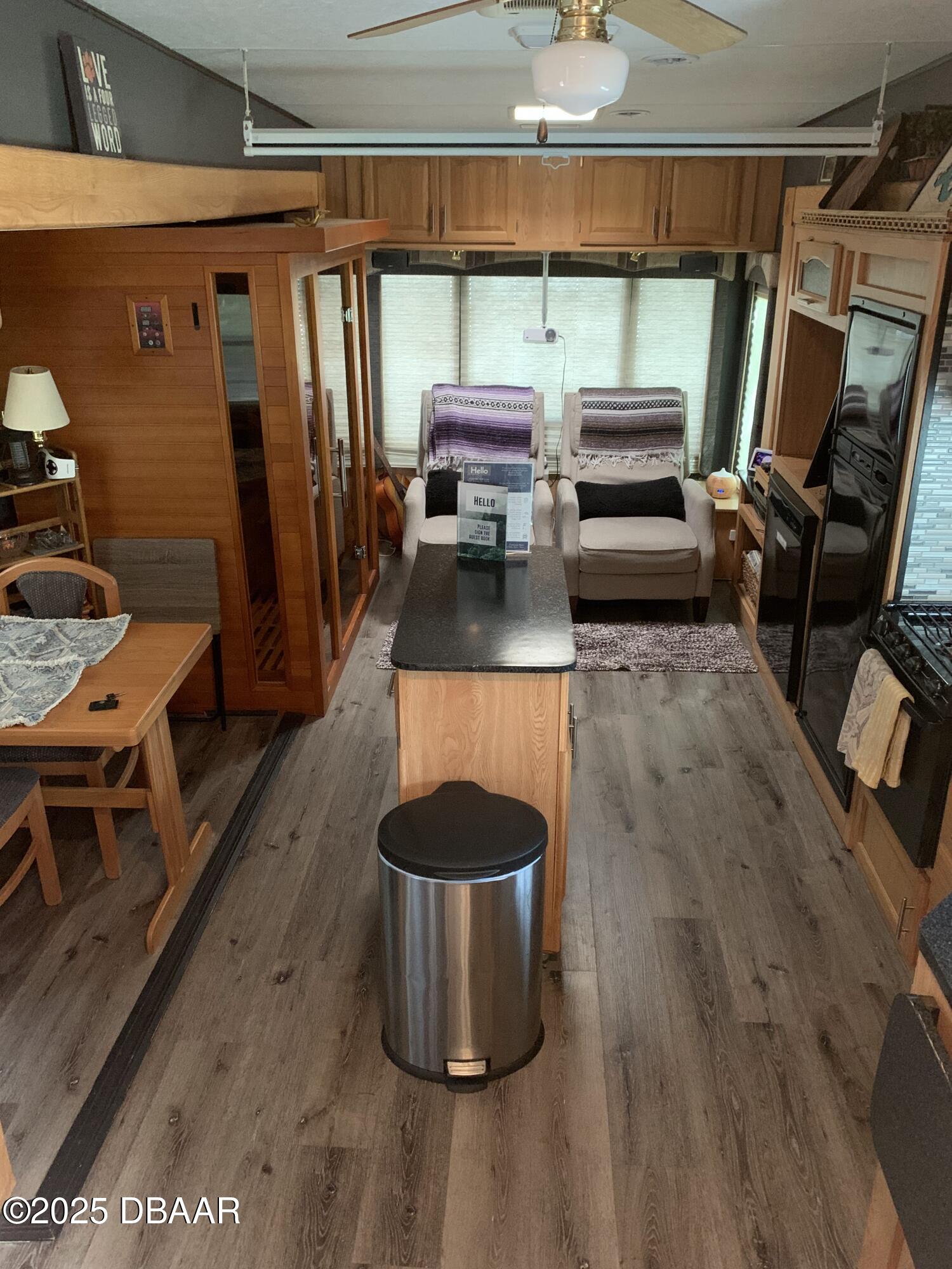 25145 Northeast 140th Loop Salt Springs, FL 32134 - Photo 6 of 48 a living room with furniture and a flat screen tv