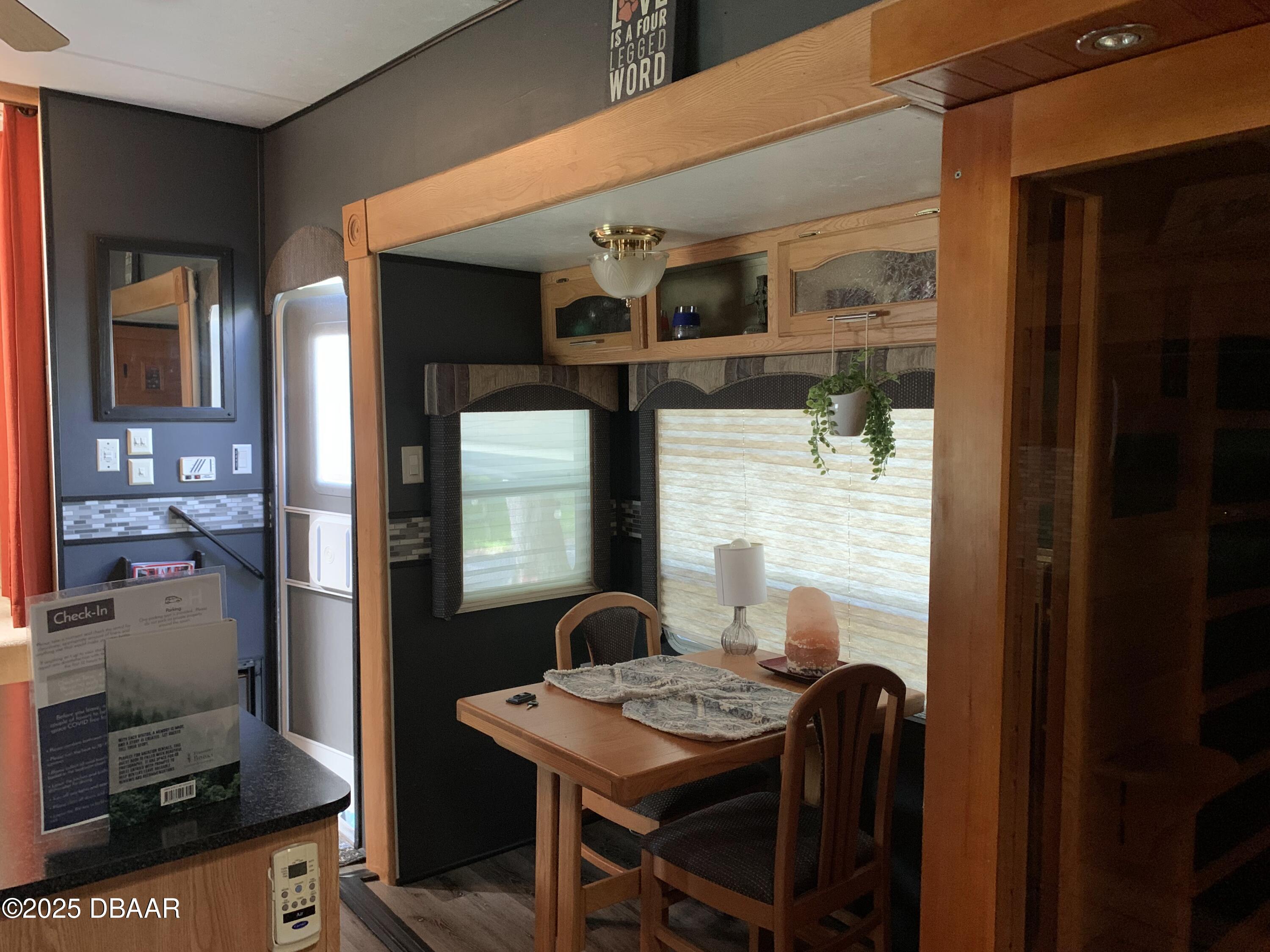 25145 Northeast 140th Loop Salt Springs, FL 32134 - Photo 7 of 48 a view of a dining room with furniture