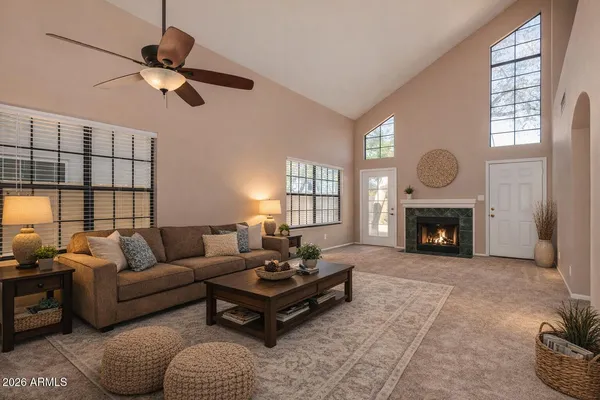 a living room with furniture and a fireplace