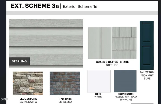 an aerial view of a house with a yard and lake view