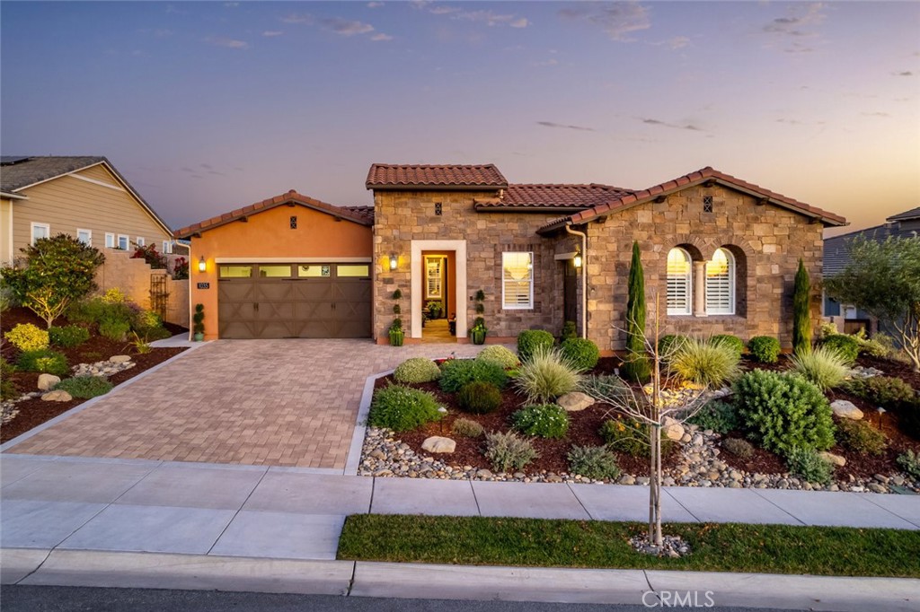 1035 Gavin Lane Nipomo, CA 93444 - Photo 1 of 70 a front view of a house with a yard and potted plants