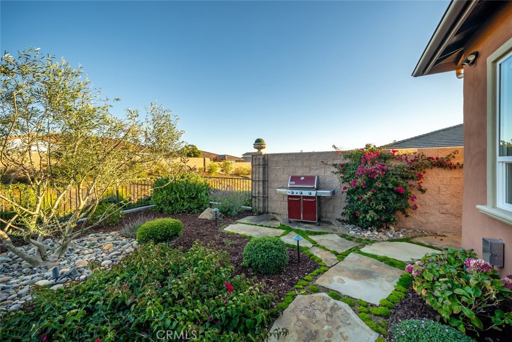 1035 Gavin Lane Nipomo, CA 93444 - Photo 25 of 70 a view of a house with a yard and potted plants