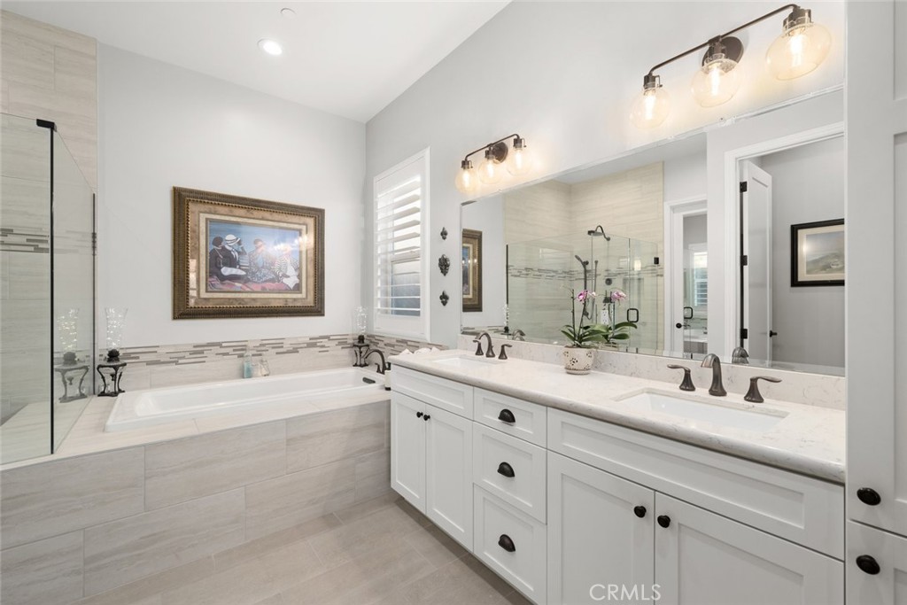 1035 Gavin Lane Nipomo, CA 93444 - Photo 30 of 70 a bathroom with a double vanity sink mirror double and bathtub