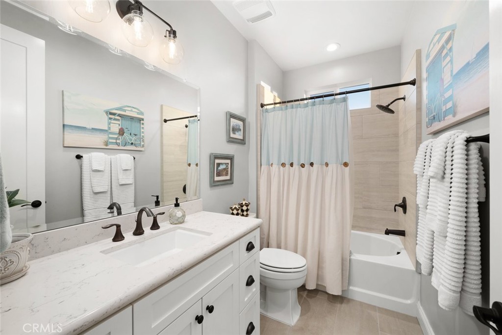 1035 Gavin Lane Nipomo, CA 93444 - Photo 40 of 70 a bathroom with a granite countertop sink a toilet and shower