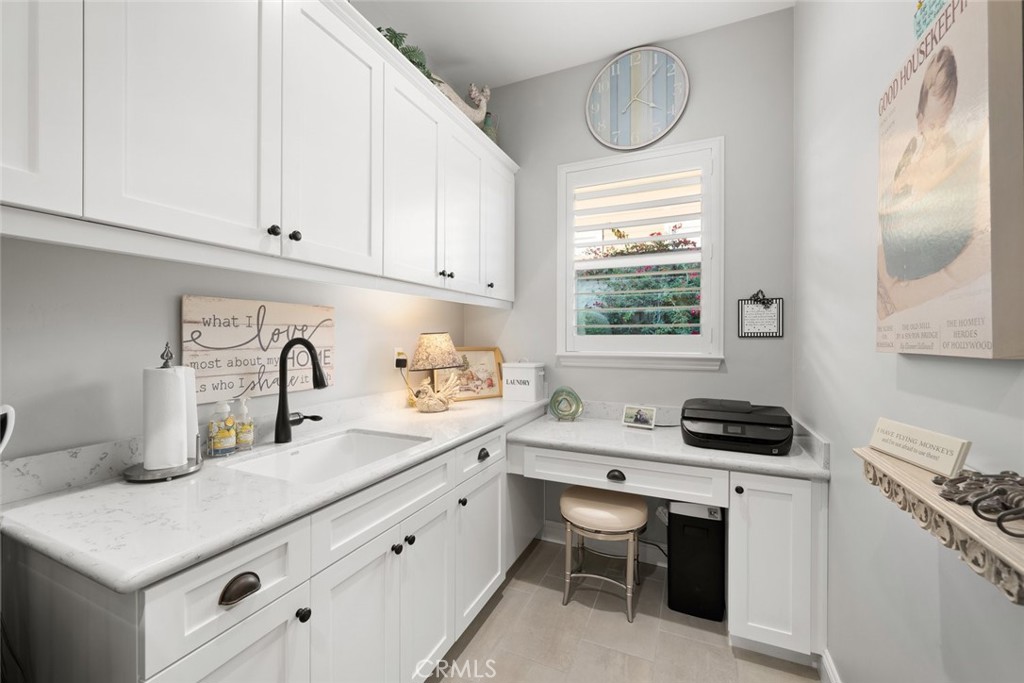 1035 Gavin Lane Nipomo, CA 93444 - Photo 46 of 70 a kitchen with a sink stove and cabinets