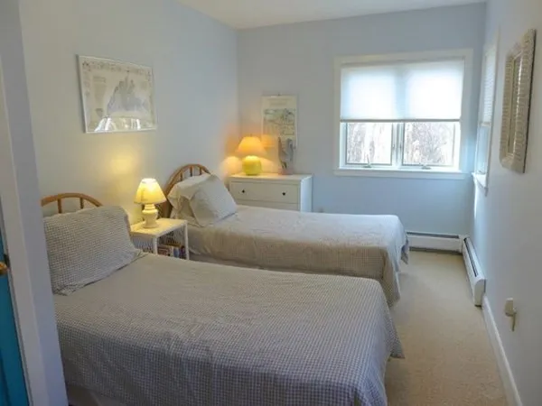 a bed room with a bed and a window