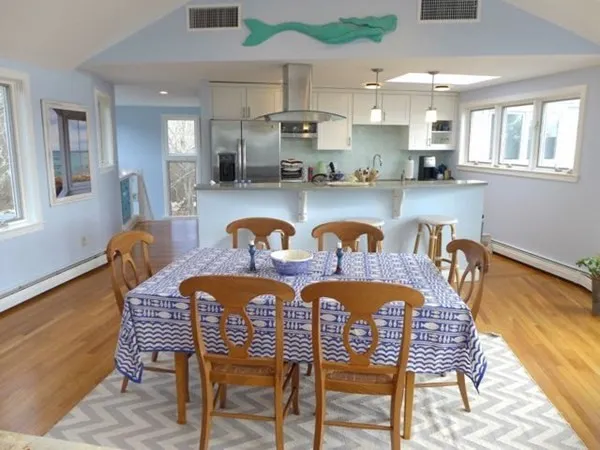 a dining room with furniture and window