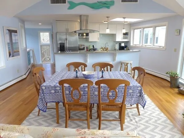 a dining room with furniture and window