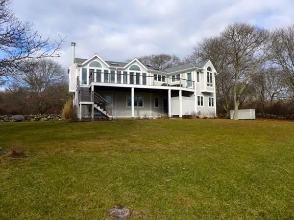 a view of houses with yard and lake view