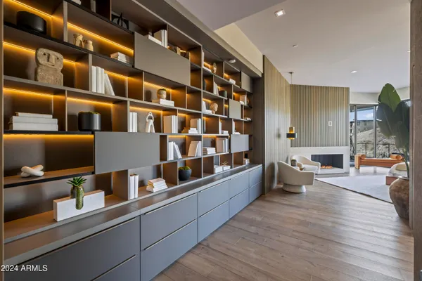 a large white room with a large window and furniture