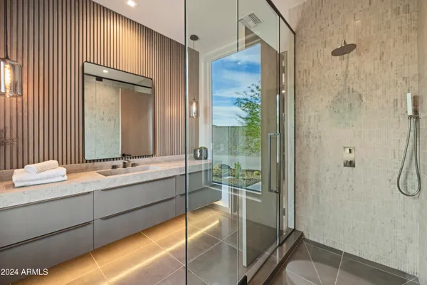 a bed room with a bed window and a mirror