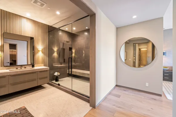 a bedroom with bed and wooden floor