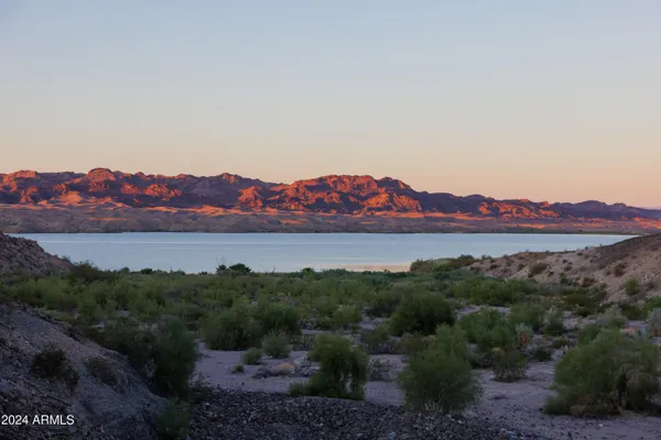 a view of a golf course with a mountain