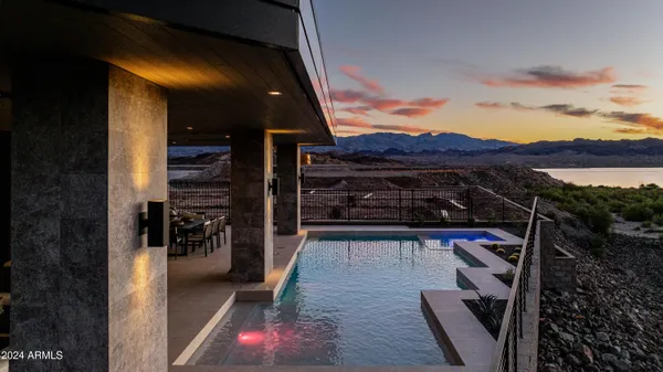 a view of swimming pool with sunset view