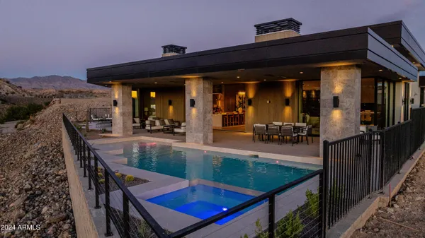 a view of a house with backyard and porch