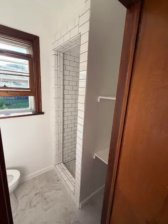 a bathroom with a toilet and a sink
