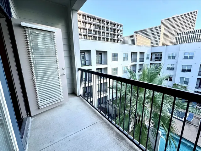 a view of living room with furniture and flat screen