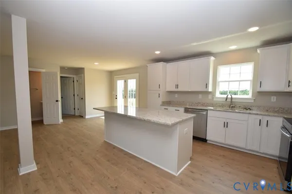 a view of a kitchen with a sink and a window