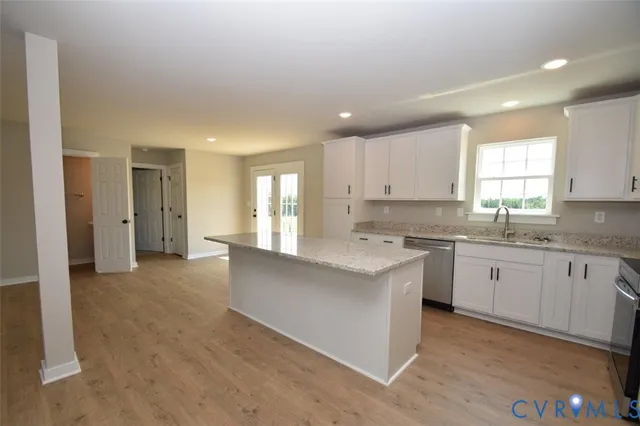 a view of a kitchen with a sink and a window