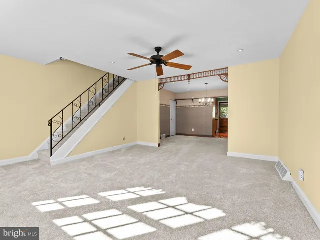 a view of a livingroom with stairs