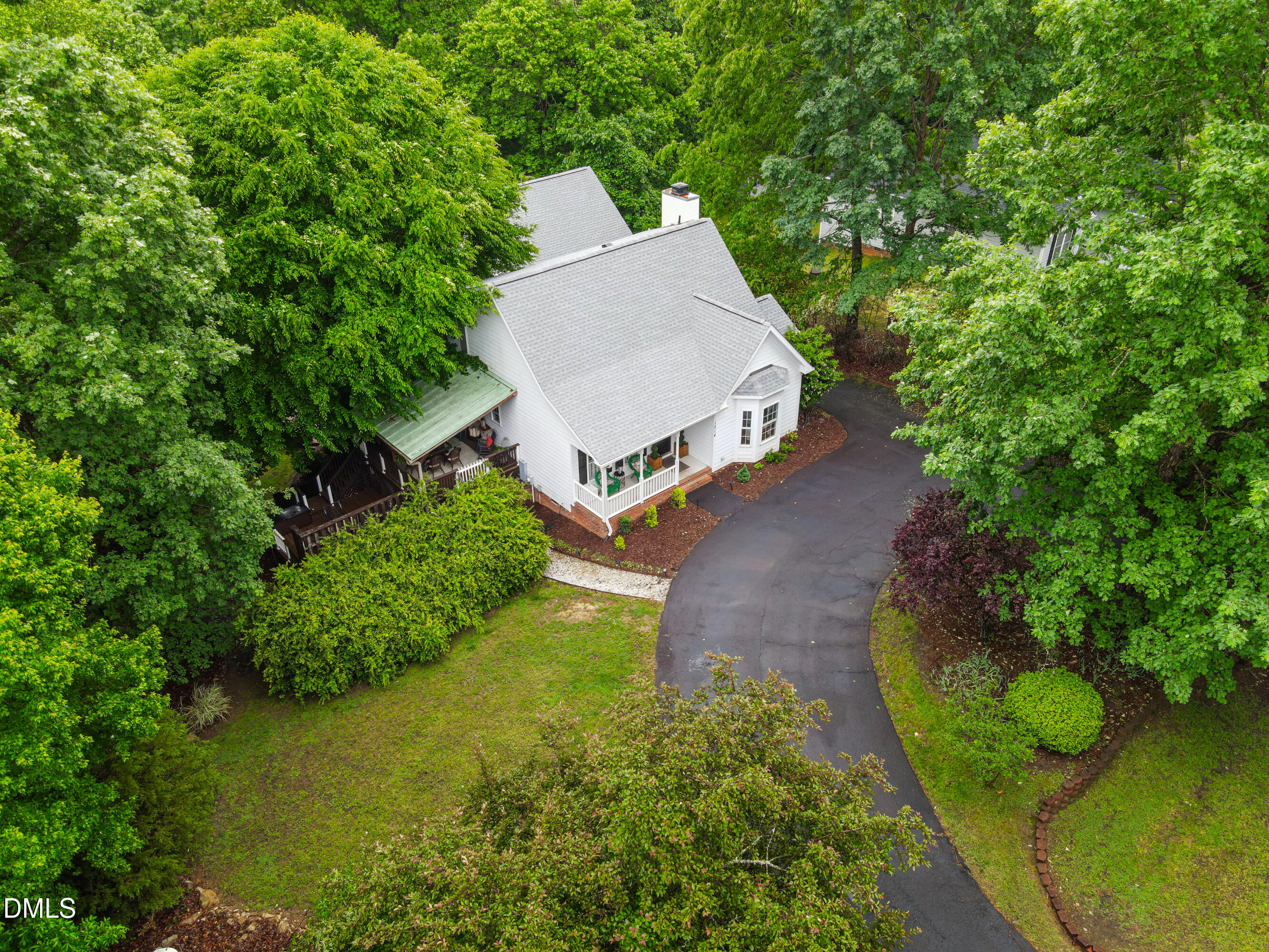 1214 Halcyon Place Rougemont, NC 27572 - Photo 60 of 69 an aerial view of a house with garden space sitting space and trees all around
