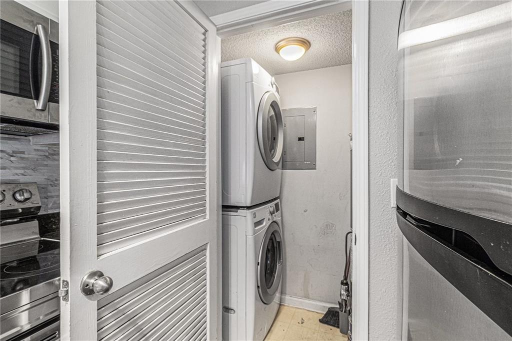 2657 Lenox Road Northeast, Unit 69 Atlanta, GA 30324 - Photo 12 of 31 a utility room with dryer and washer