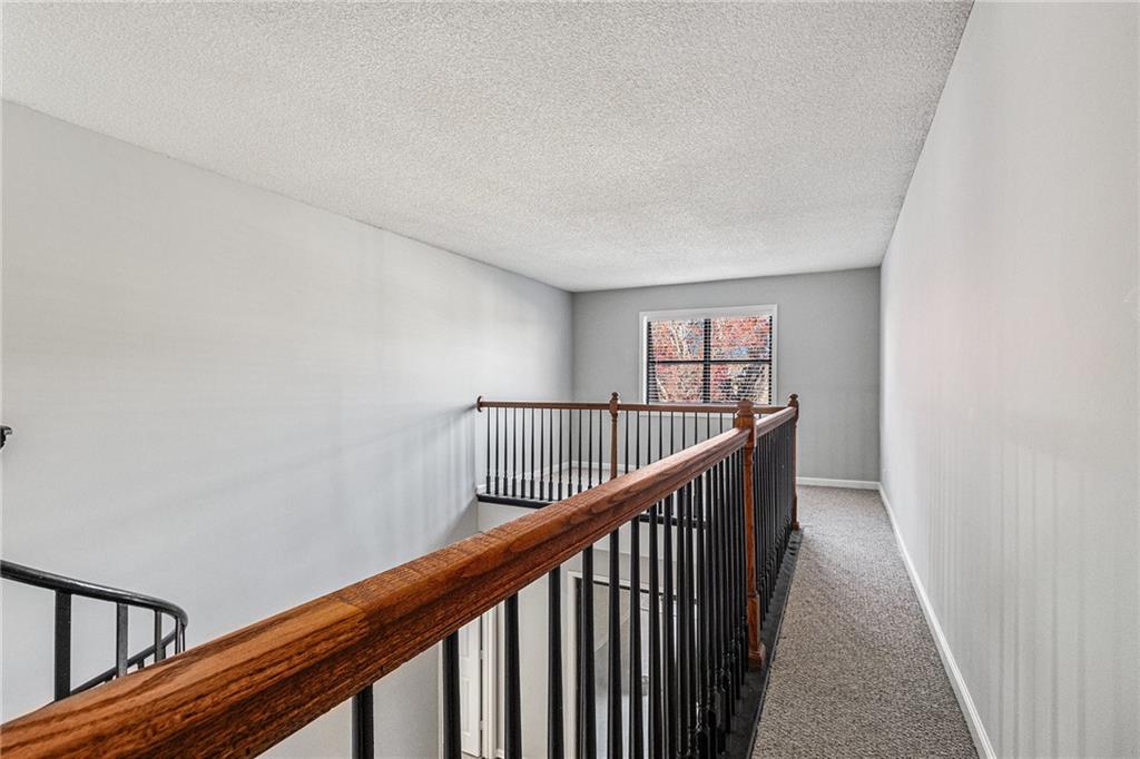 2657 Lenox Road Northeast, Unit 69 Atlanta, GA 30324 - Photo 19 of 31 a view of a hallway with wooden floor
