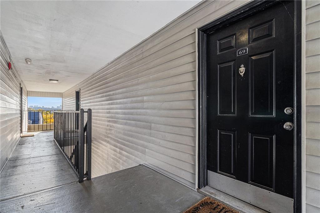 2657 Lenox Road Northeast, Unit 69 Atlanta, GA 30324 - Photo 3 of 31 a view of a hallway with wooden walls