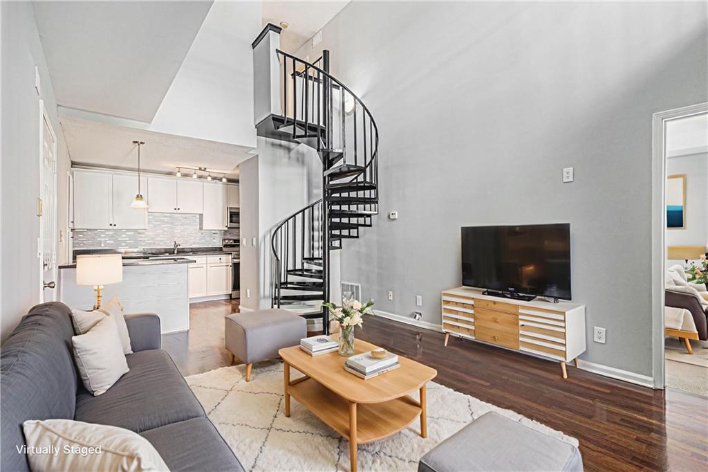2657 Lenox Road Northeast, Unit 69 Atlanta, GA 30324 - Photo 5 of 31 a living room with furniture and a flat screen tv