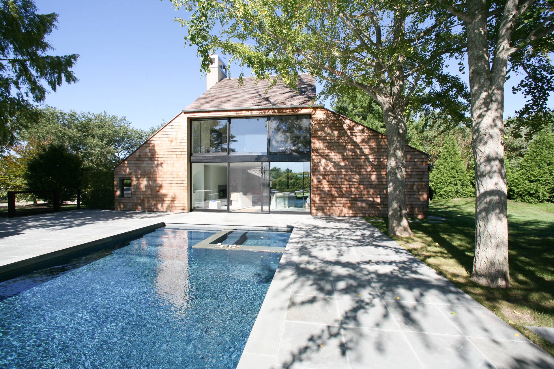 635 Lumber Lane Bridgehampton, NY 11932 - Photo 6 of 27 a front view of a house with a yard