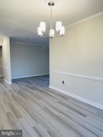 a kitchen with granite countertop a refrigerator and a stove