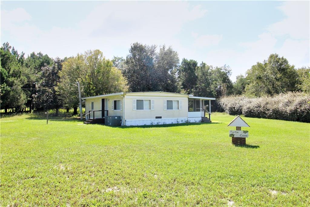 7708 West Riverbend Road Dunnellon, FL 34433 - Photo 1 of 1 Front view of home