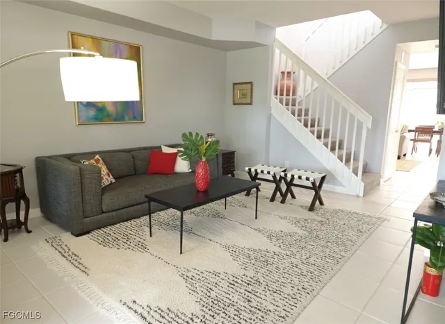 a living room with furniture and white walls
