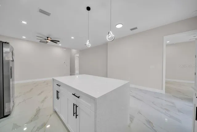 a bathroom with a sink a vanity and a shower
