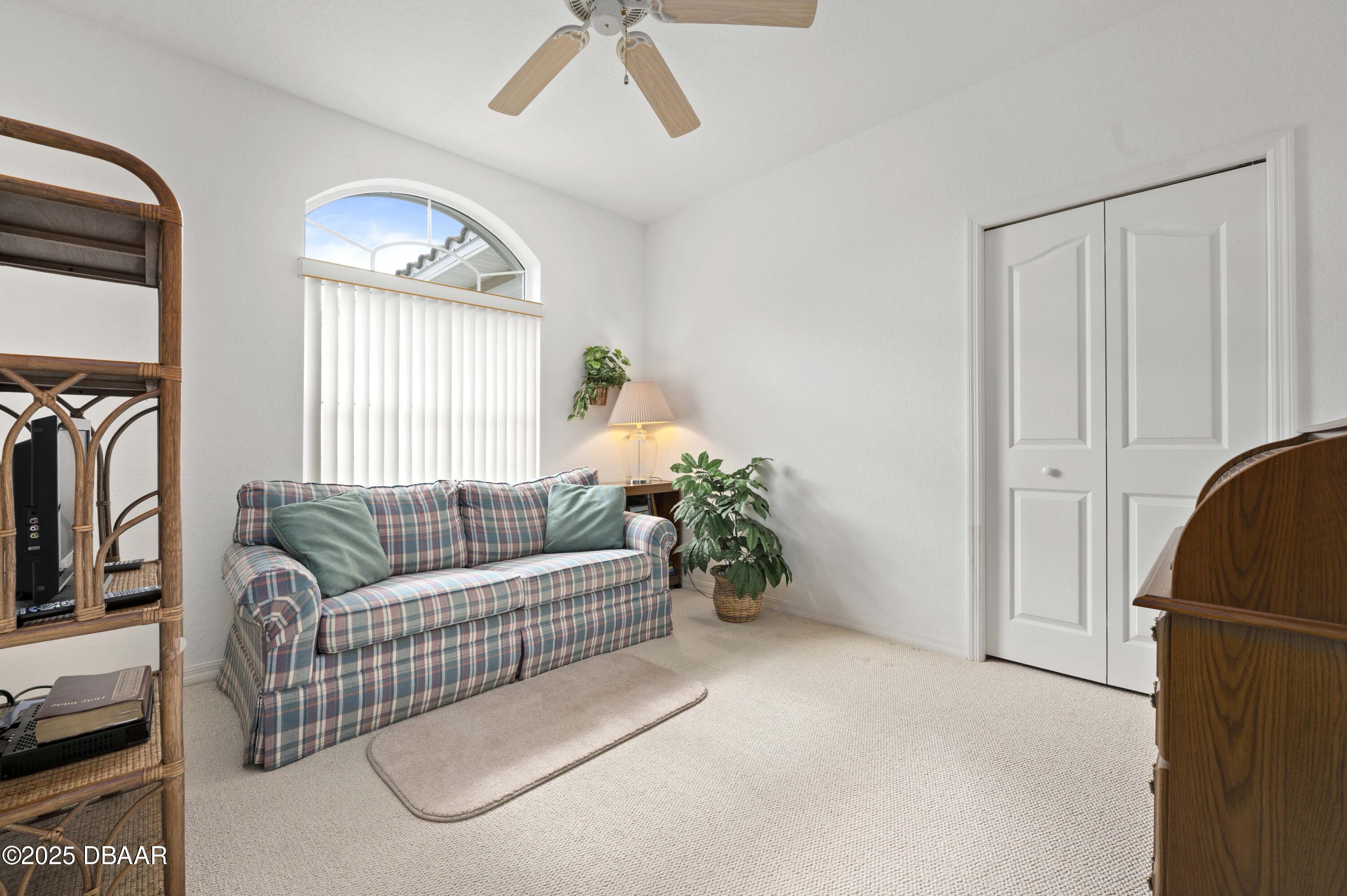 38 South Turn Circle Ponce Inlet, FL 32127 - Photo 22 of 49 a living room with furniture and a window