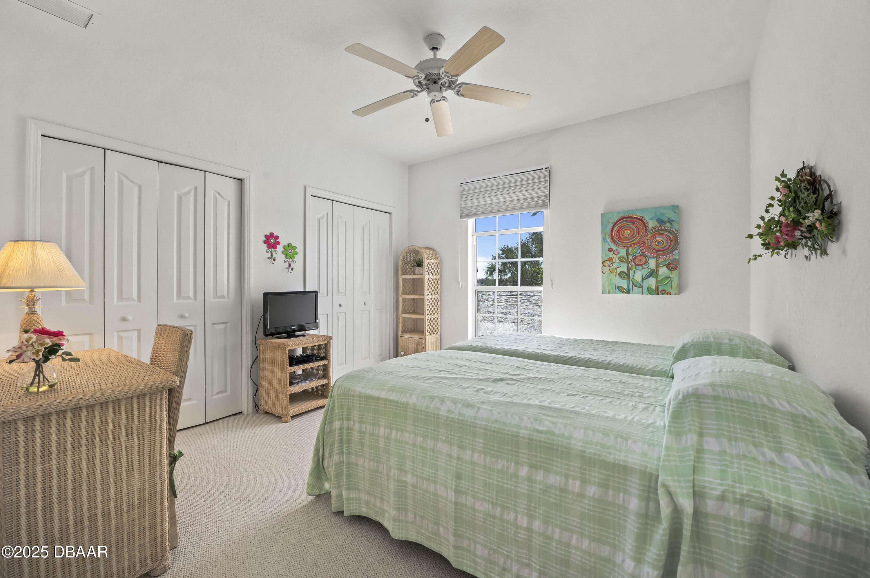 38 South Turn Circle Ponce Inlet, FL 32127 - Photo 26 of 49 a bedroom with a bed and a chandelier