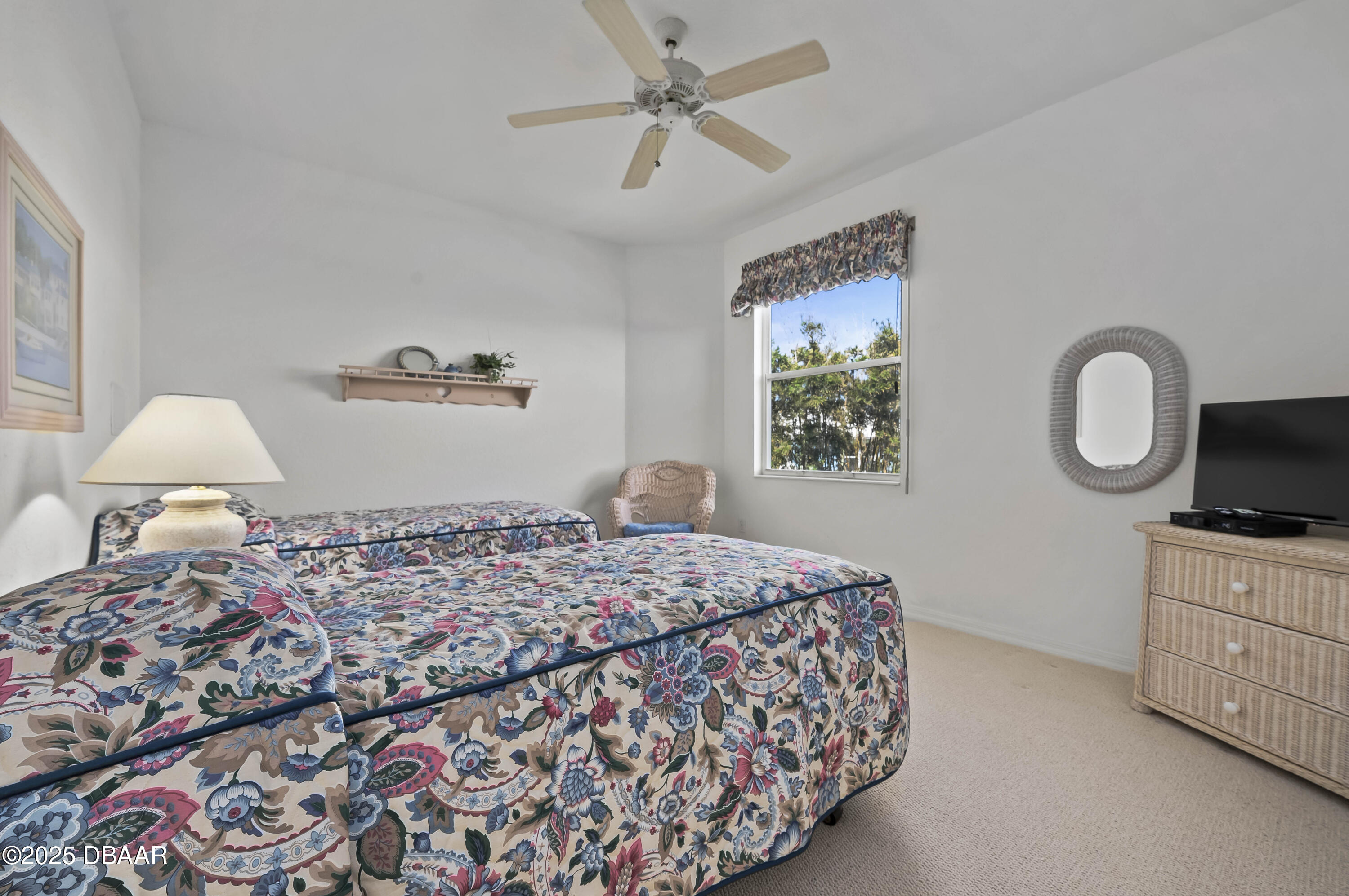 38 South Turn Circle Ponce Inlet, FL 32127 - Photo 30 of 49 a bedroom with a bed dresser and a window