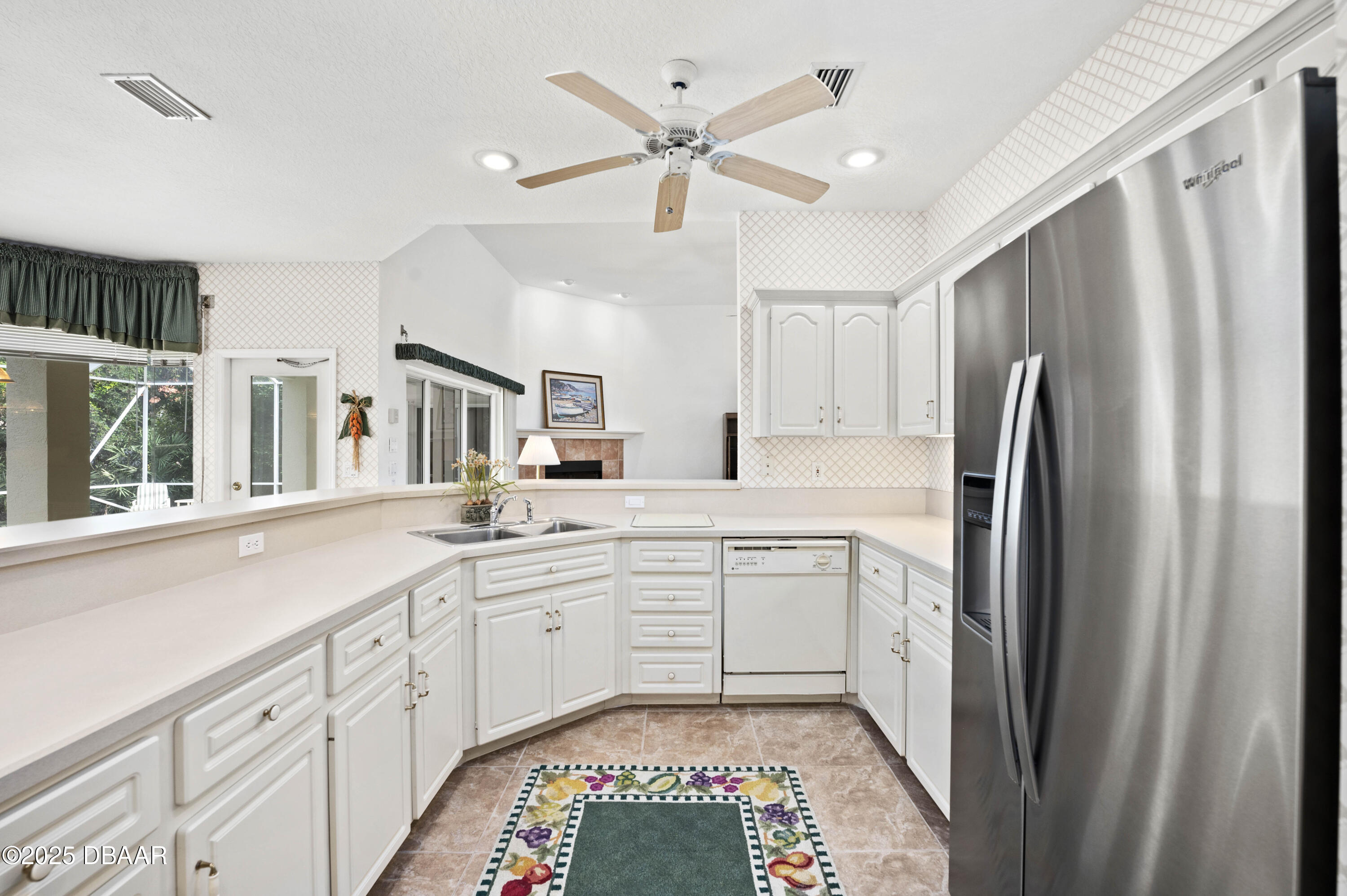 38 South Turn Circle Ponce Inlet, FL 32127 - Photo 3 of 49 a kitchen with white cabinets and white appliances