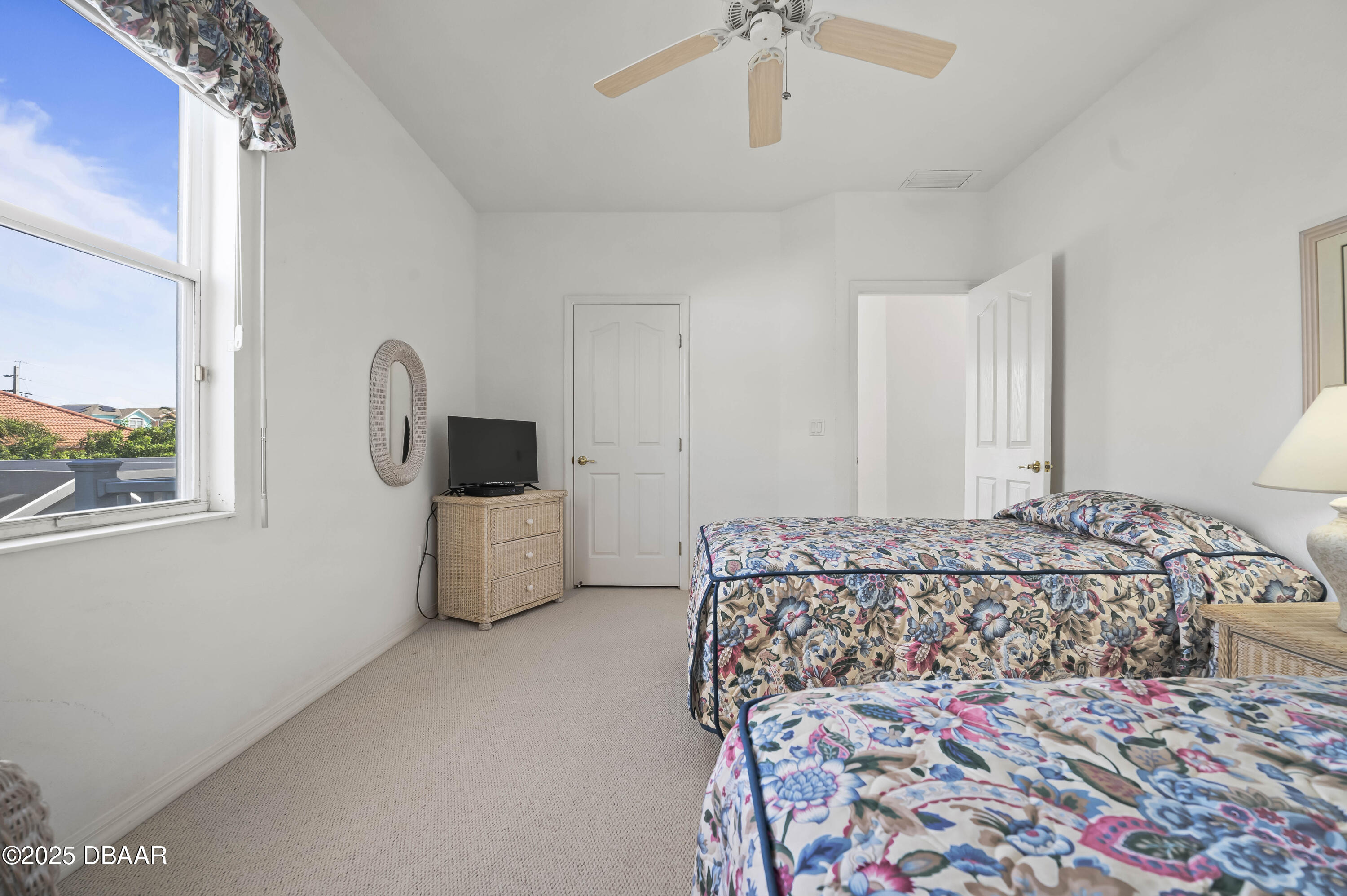 38 South Turn Circle Ponce Inlet, FL 32127 - Photo 31 of 49 a bedroom with a bed and a painting on the wall