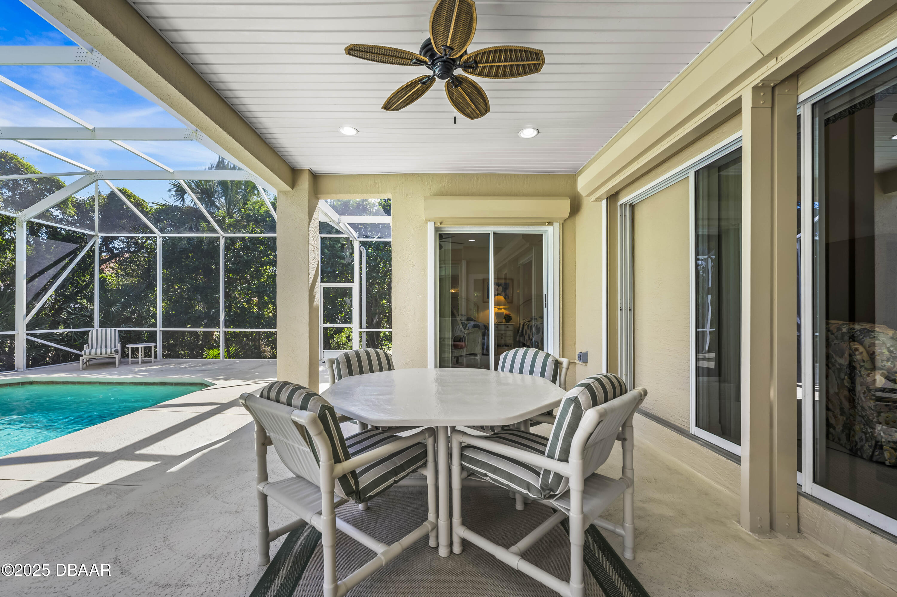 38 South Turn Circle Ponce Inlet, FL 32127 - Photo 37 of 49 a view of a patio with a table and chairs