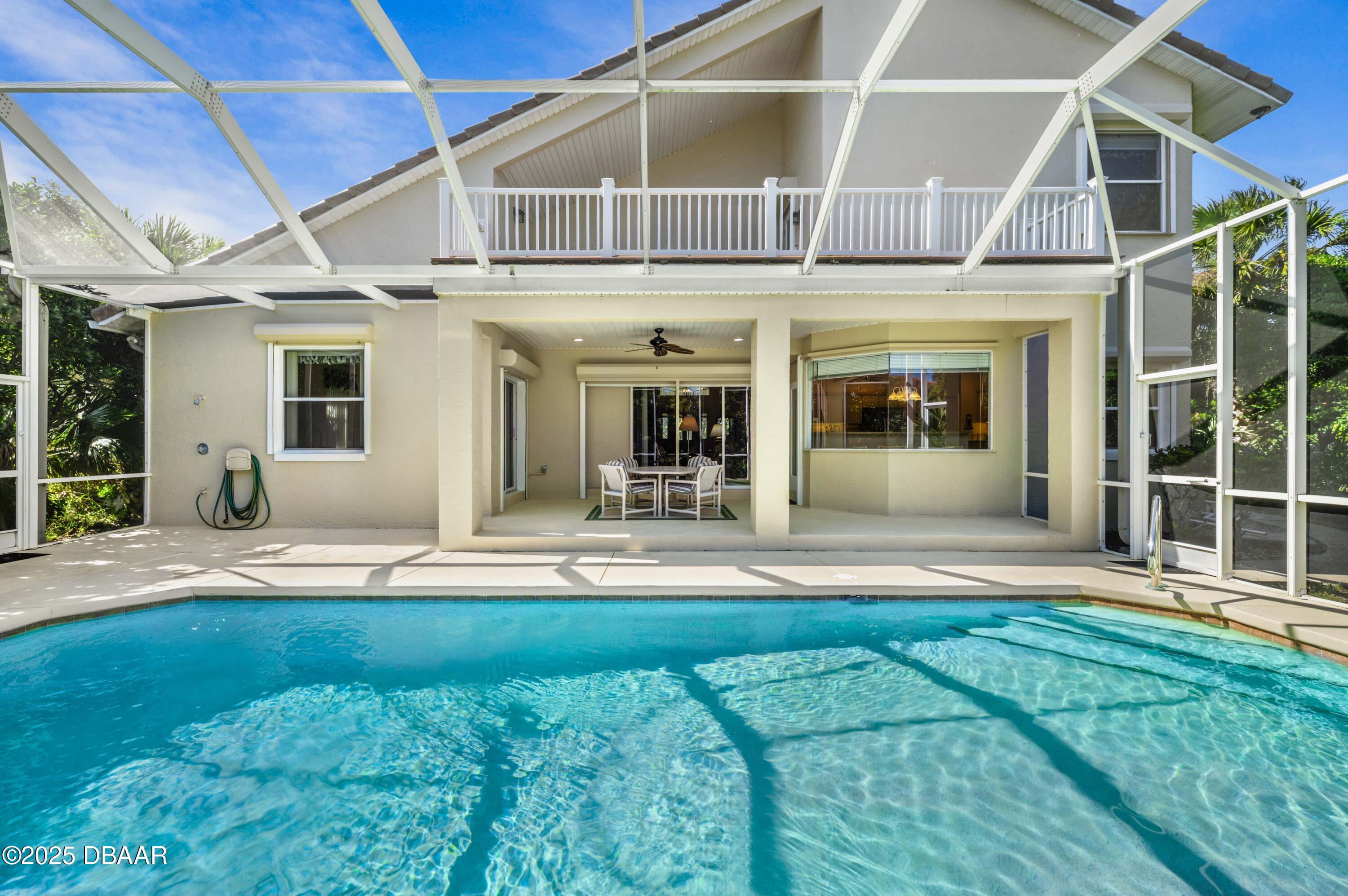 38 South Turn Circle Ponce Inlet, FL 32127 - Photo 38 of 49 a view of a house with sitting area and garden