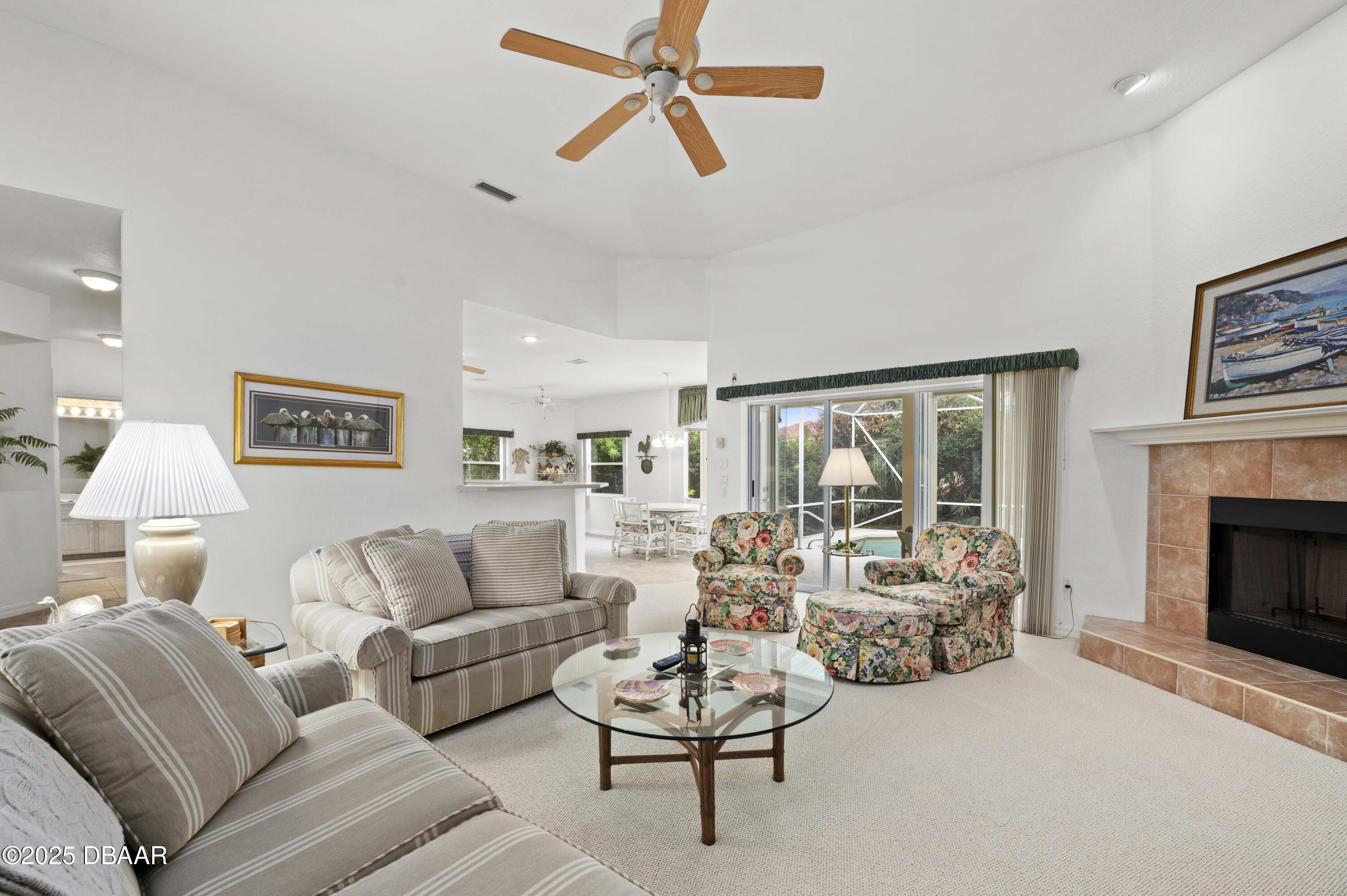 38 South Turn Circle Ponce Inlet, FL 32127 - Photo 8 of 49 a living room with furniture and a large window