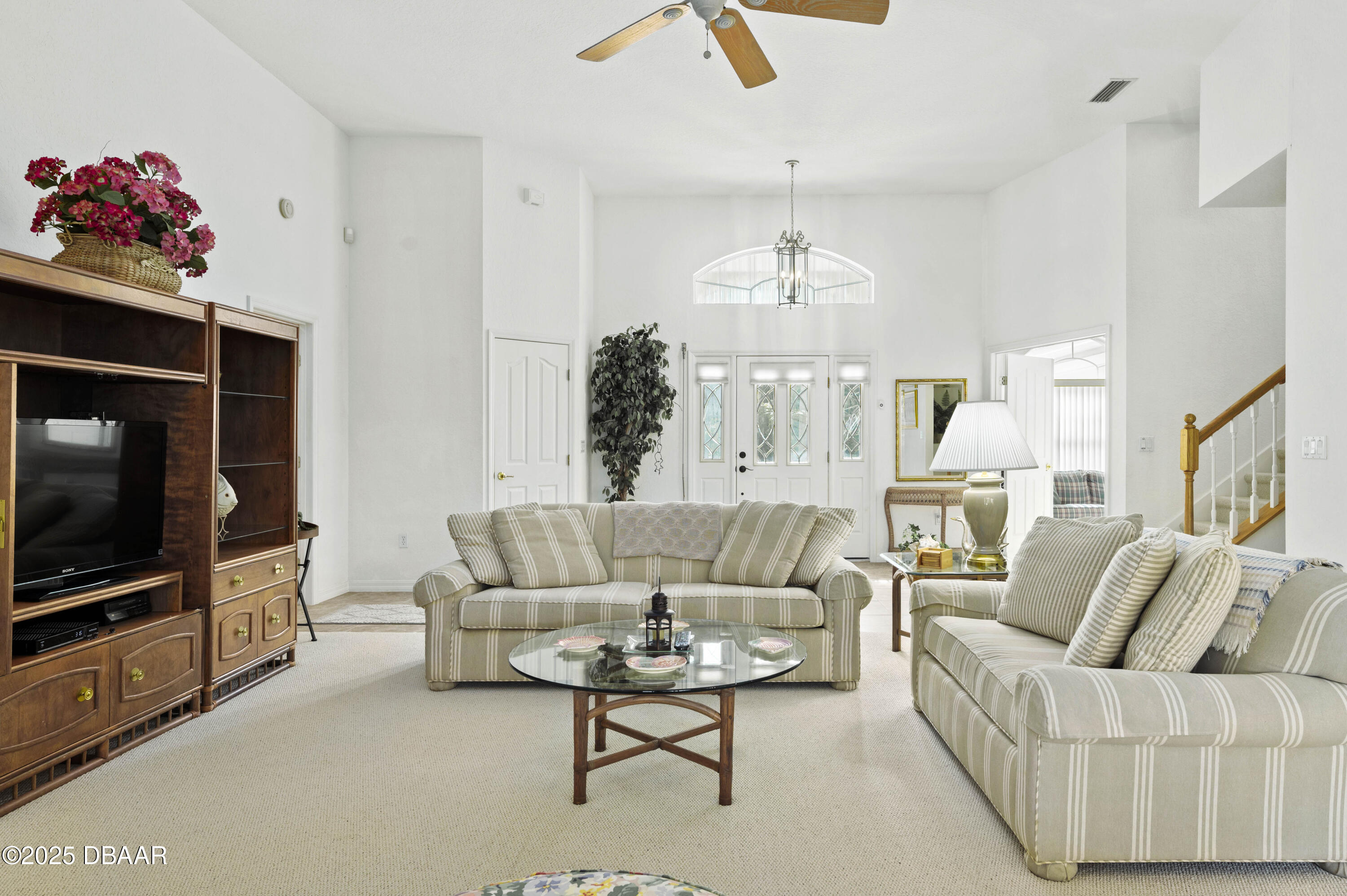 38 South Turn Circle Ponce Inlet, FL 32127 - Photo 9 of 49 a living room with furniture and a flat screen tv